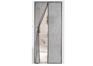 A magnetic screen door attached to a door frame