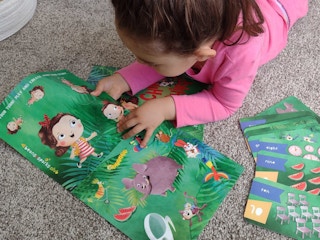 a child reading a children's book.