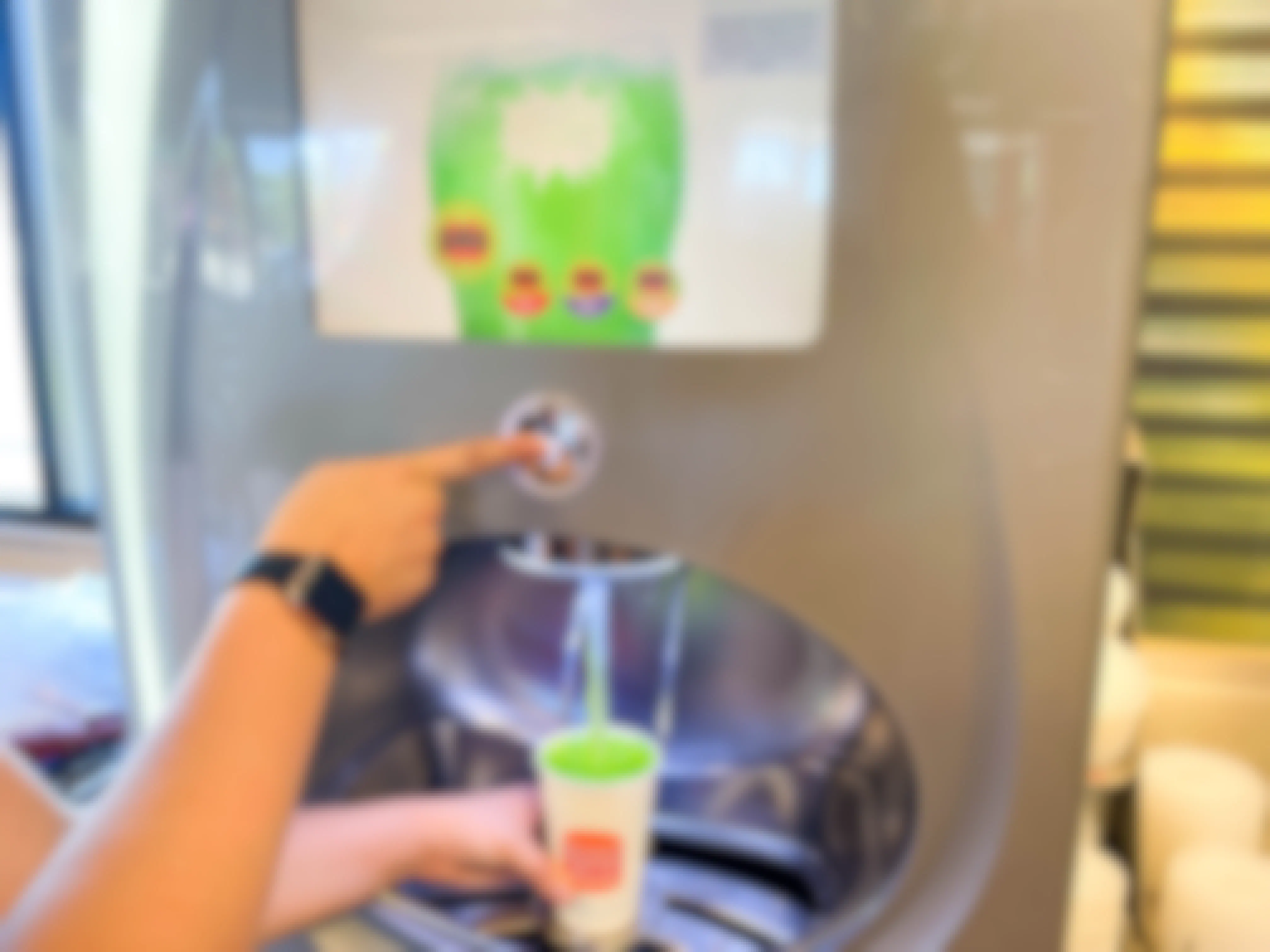 a person refilling burger king cup with surge soda