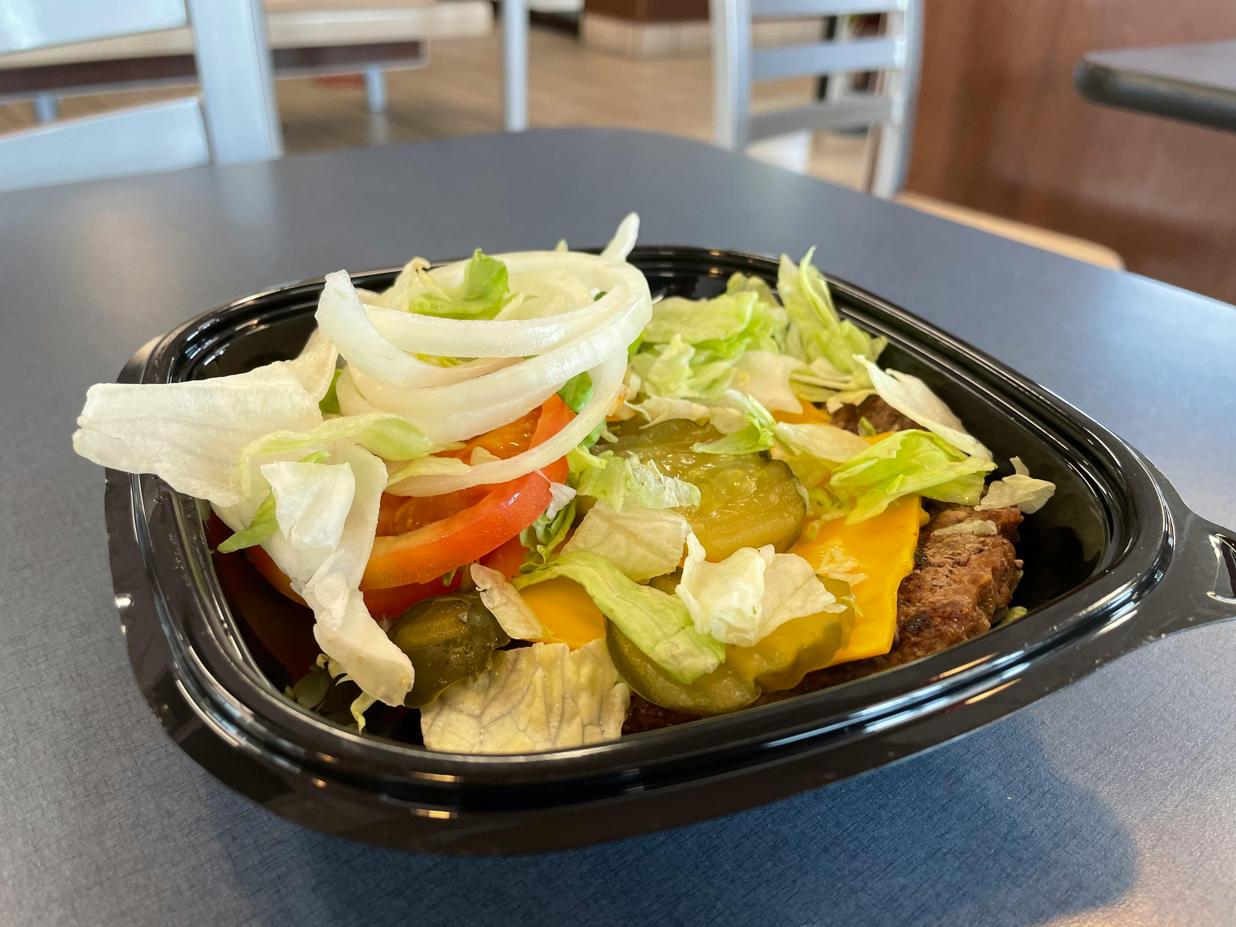 a bowl full of a burger king sandwich
