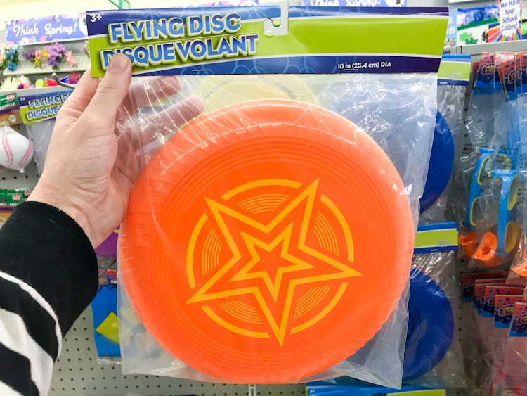 hand holding Dollar Tree frisbee