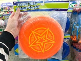 hand holding Dollar Tree frisbee