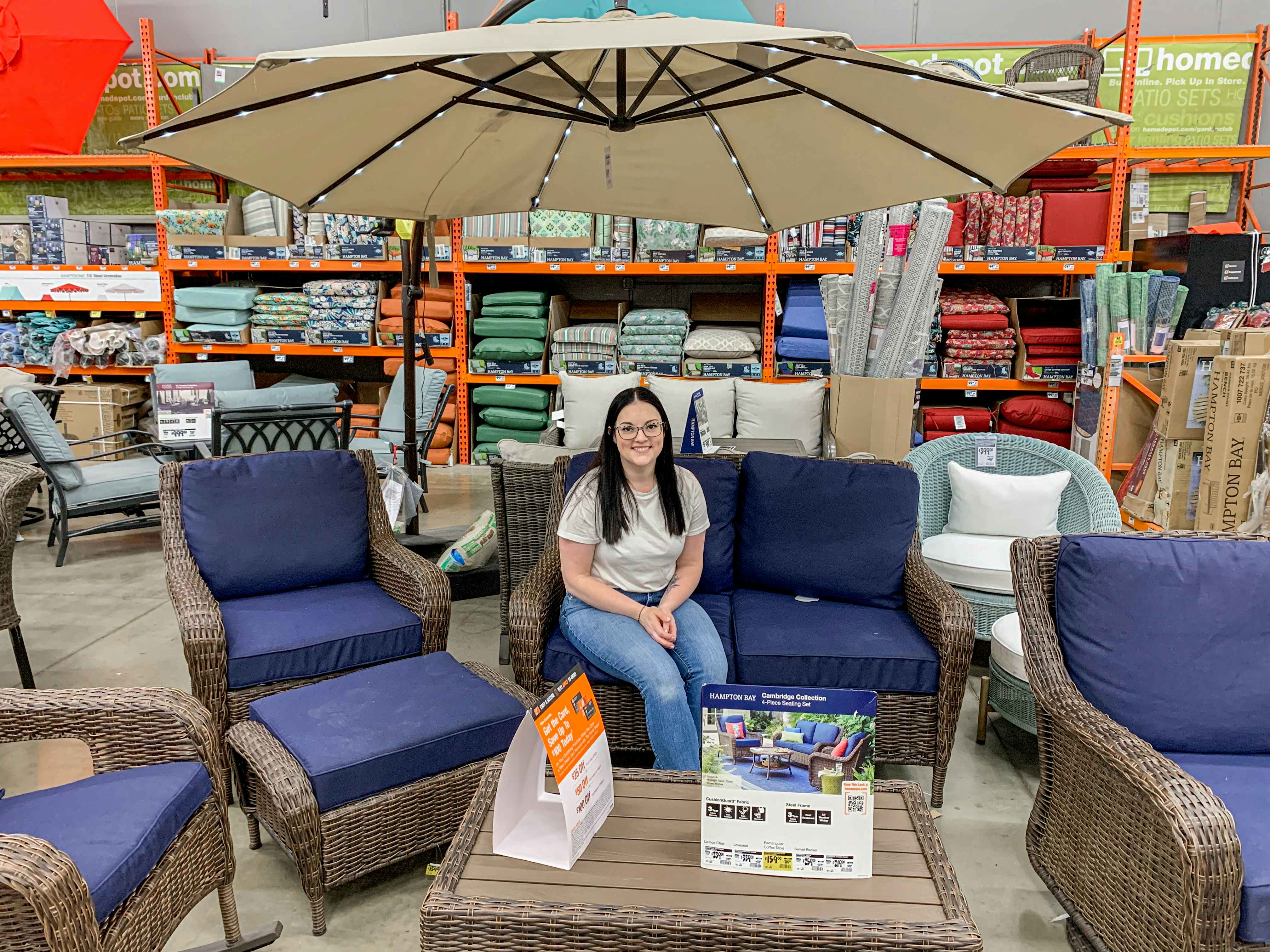 a person sitting on patio furniture at home depot