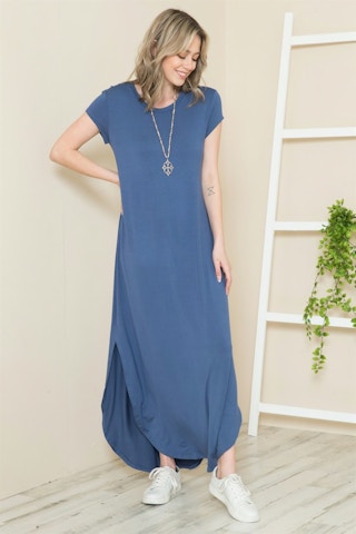 A model wearing a blue maxi dress.