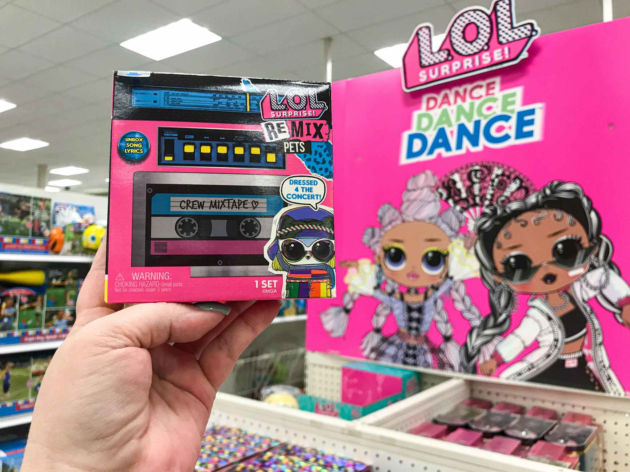 hand holding a lol surprise remix at Target