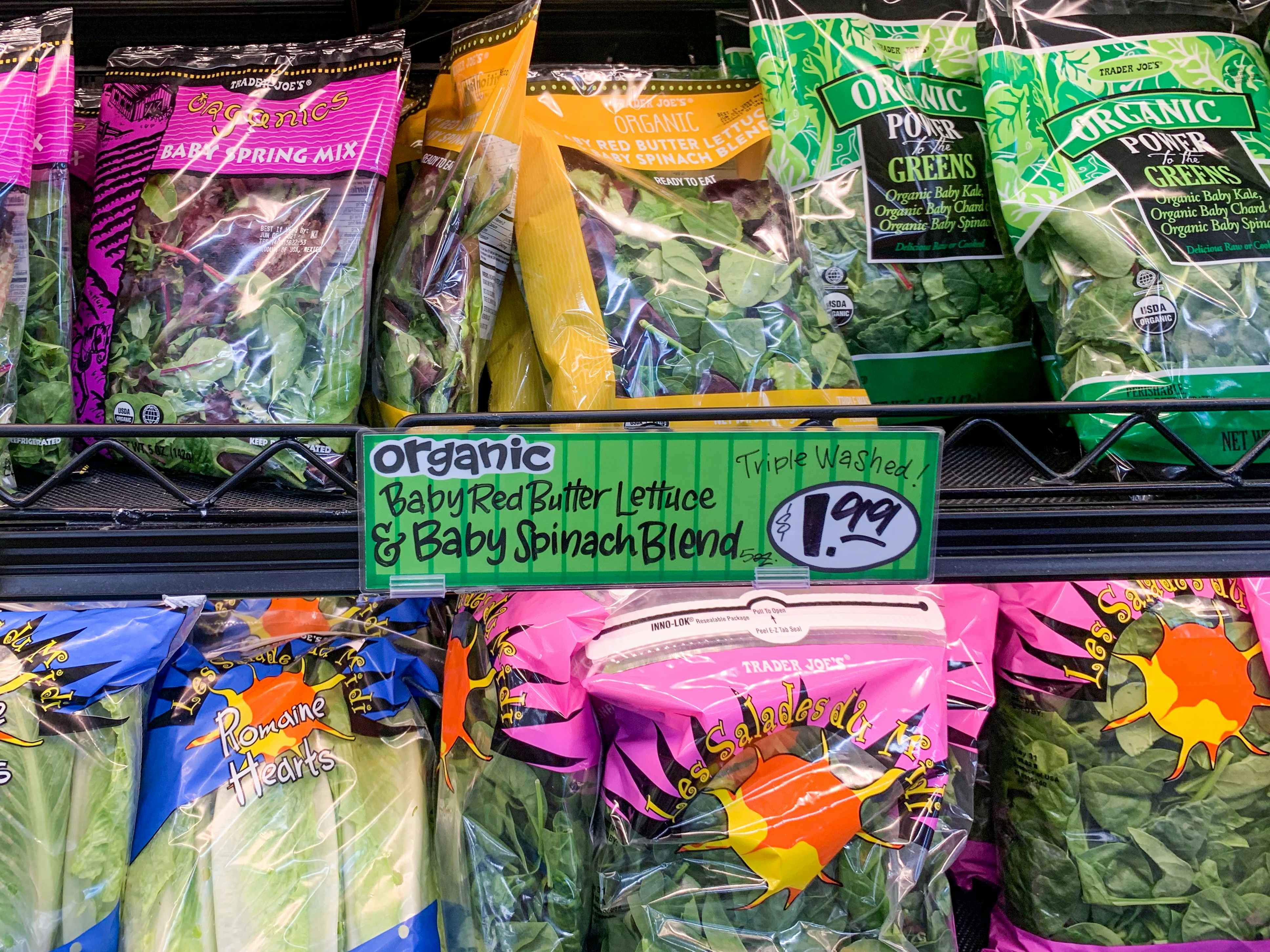 Organic spinach bags next to a $1.99 price tag