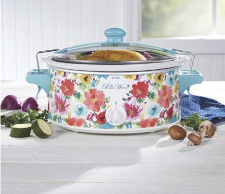 A Pioneer Woman slow cooker on a counter.