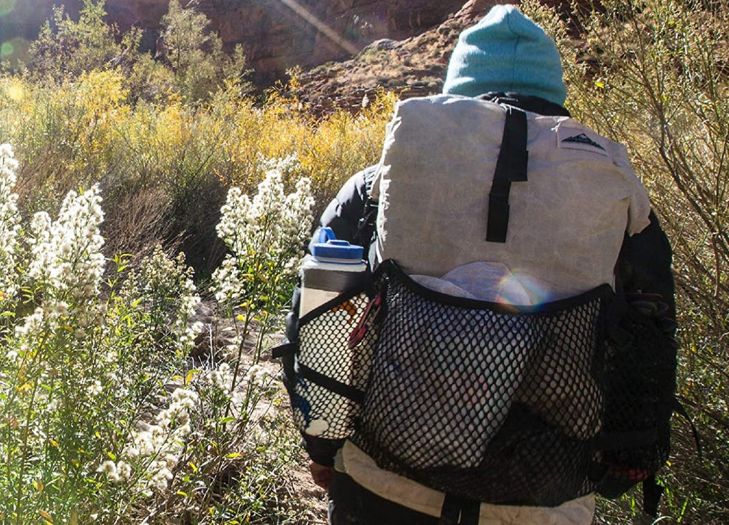 Nalgene Water Bottle in backpack on back on hike