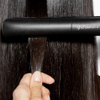 Hair straightener in brown hair