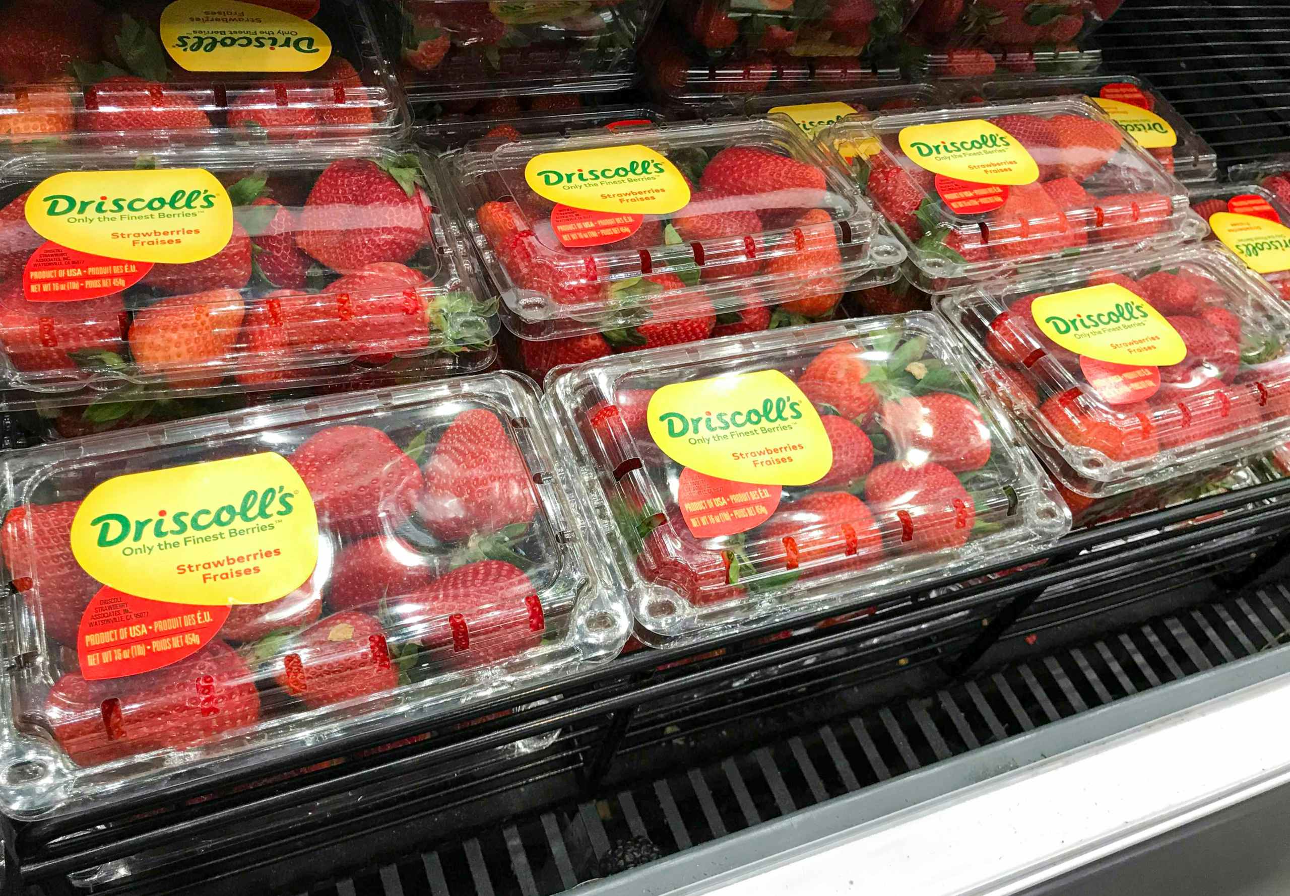 cartons of strawberries in grocery store