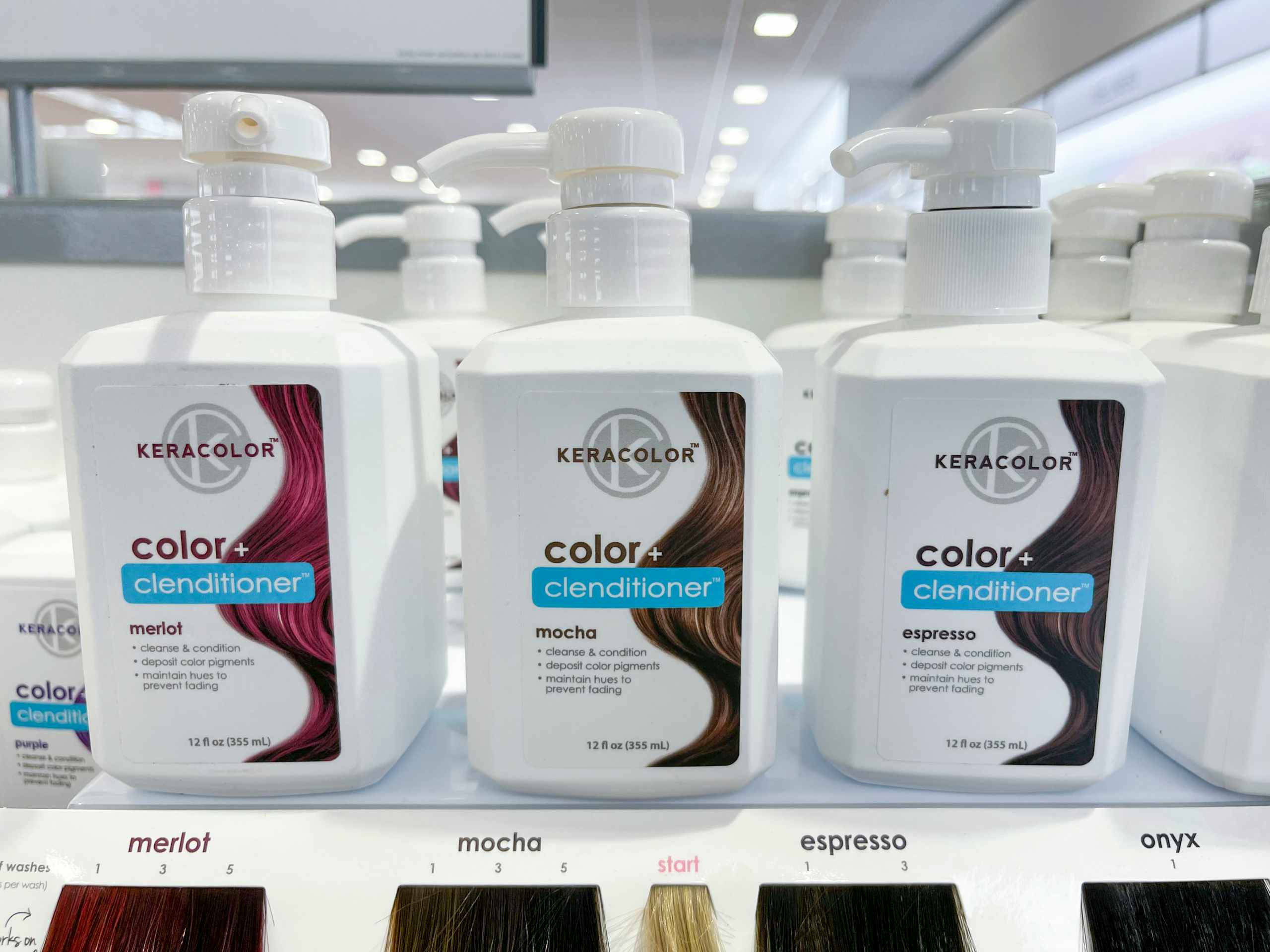Three bottles of Keracolor hair treatment on shelf.