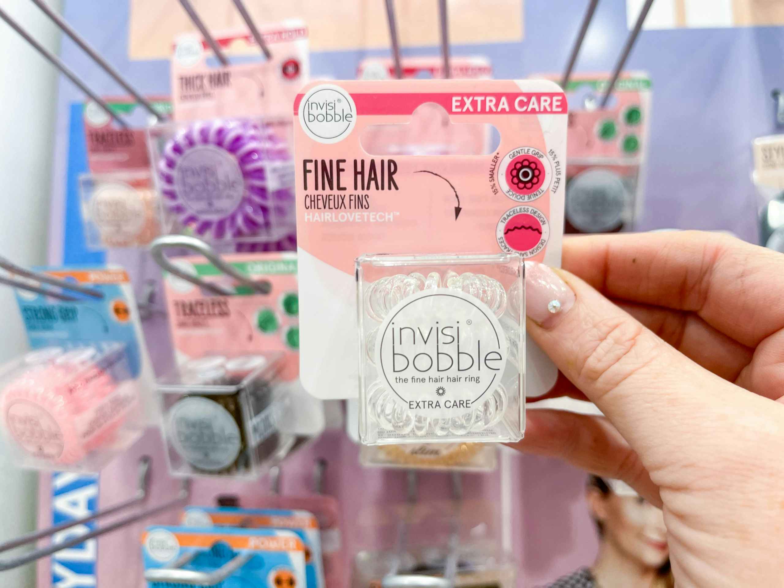 Woman holding invisibobble hair tie