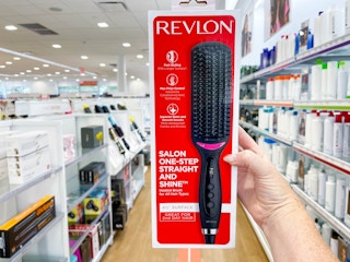 Woman holding Revlon styling brush