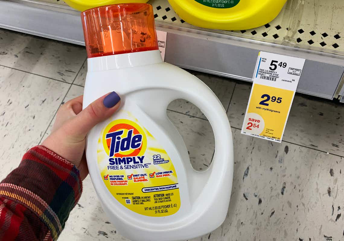 Tide simply laundry detergent next to a yellow sale tag stating the price is $2.95