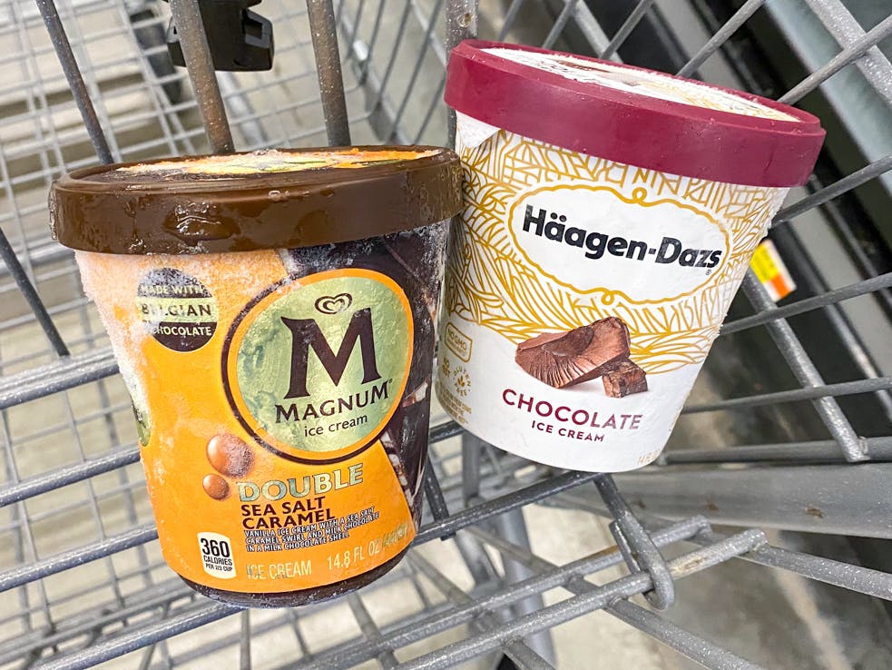 Pints of ice cream in a shopping cart basket