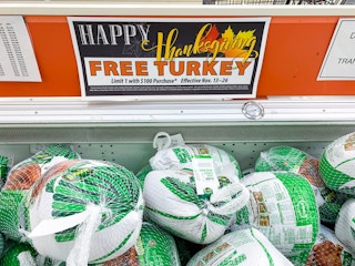 Frozen turkeys with a sign for a free thanksgiving turkey