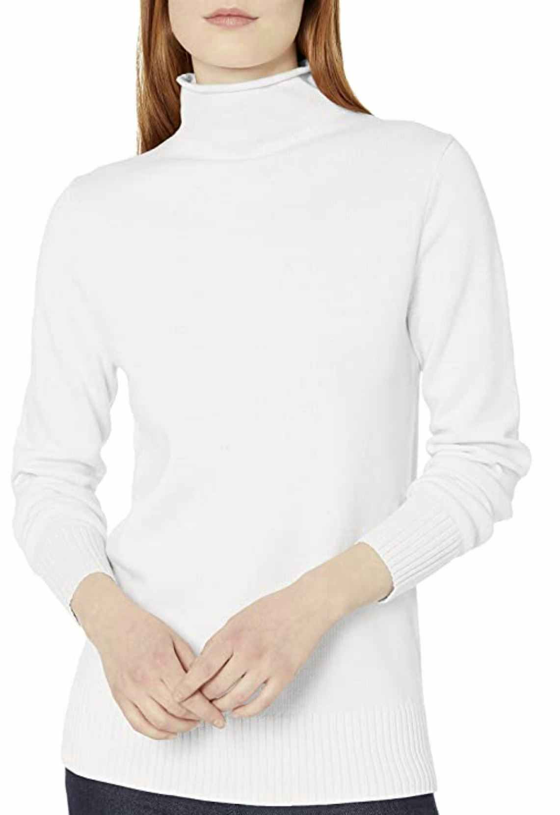 A woman wearing a white turtleneck sweater