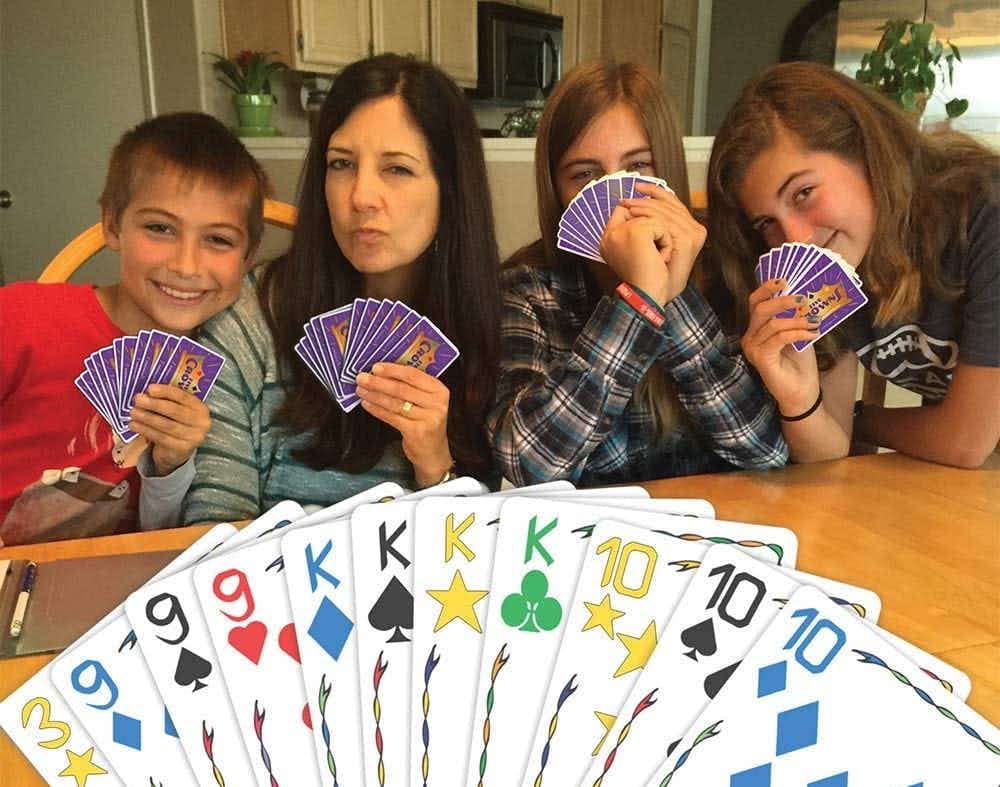 A point of view of someone playing the Five Crowns card game with their family
