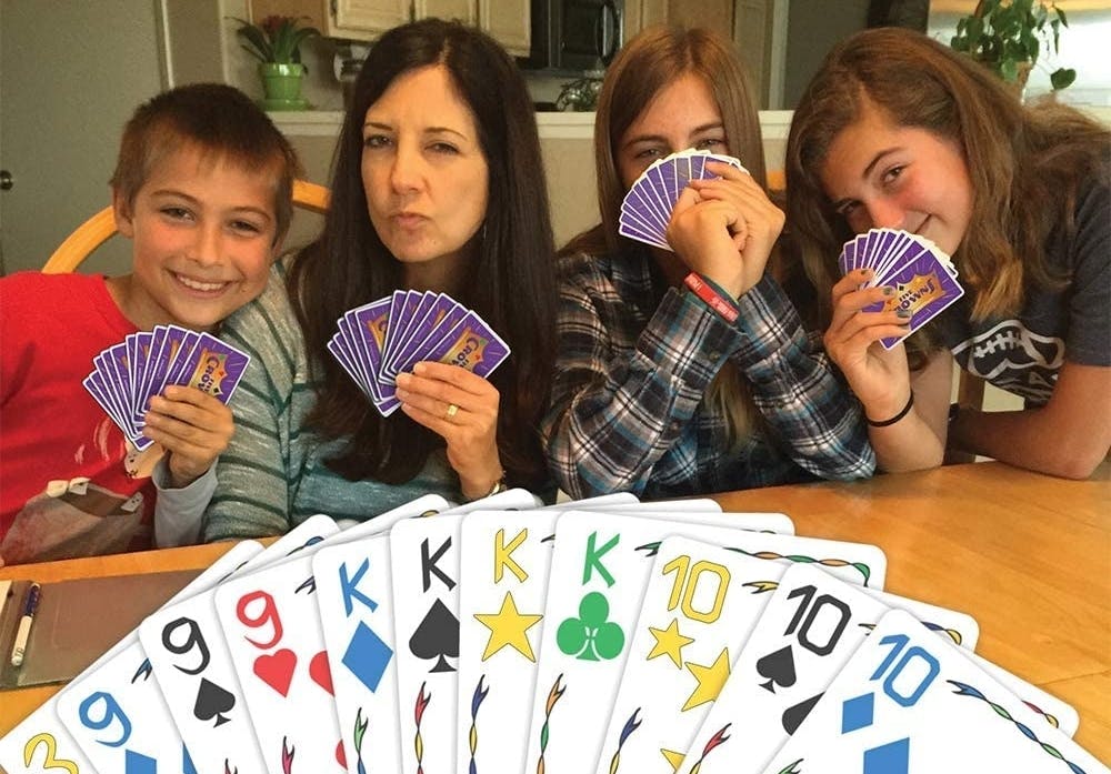 A point of view of someone playing the Five Crowns card game with their family