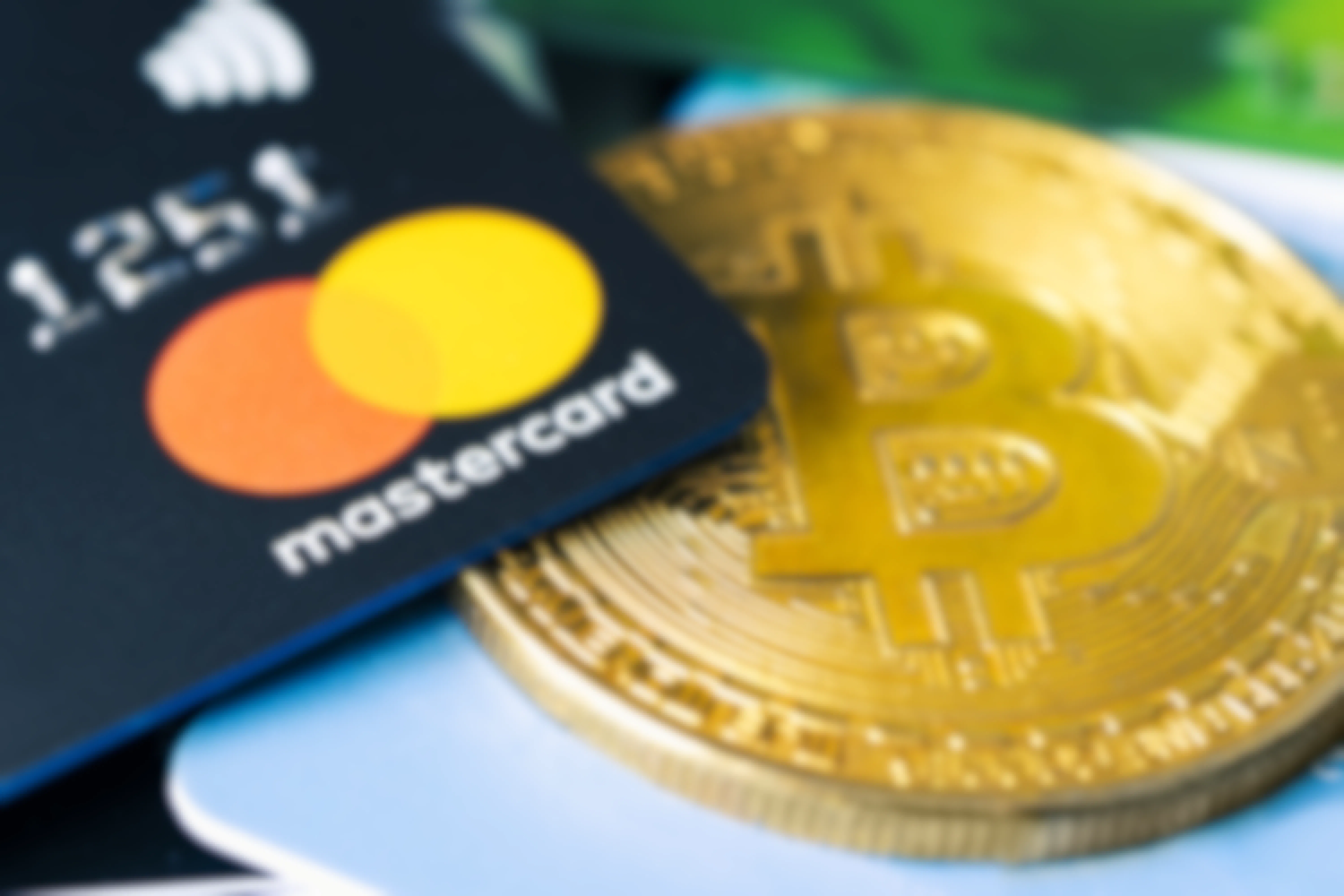 mastercard is sitting on top of a bitcoin