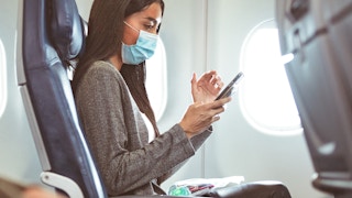 Delta Airlines passenger on phone inflight