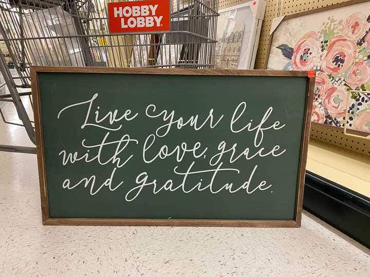 sign that says live your life with love grace and gratitude