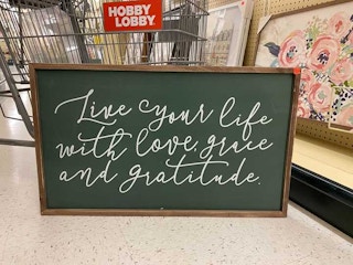 sign that says live your life with love grace and gratitude