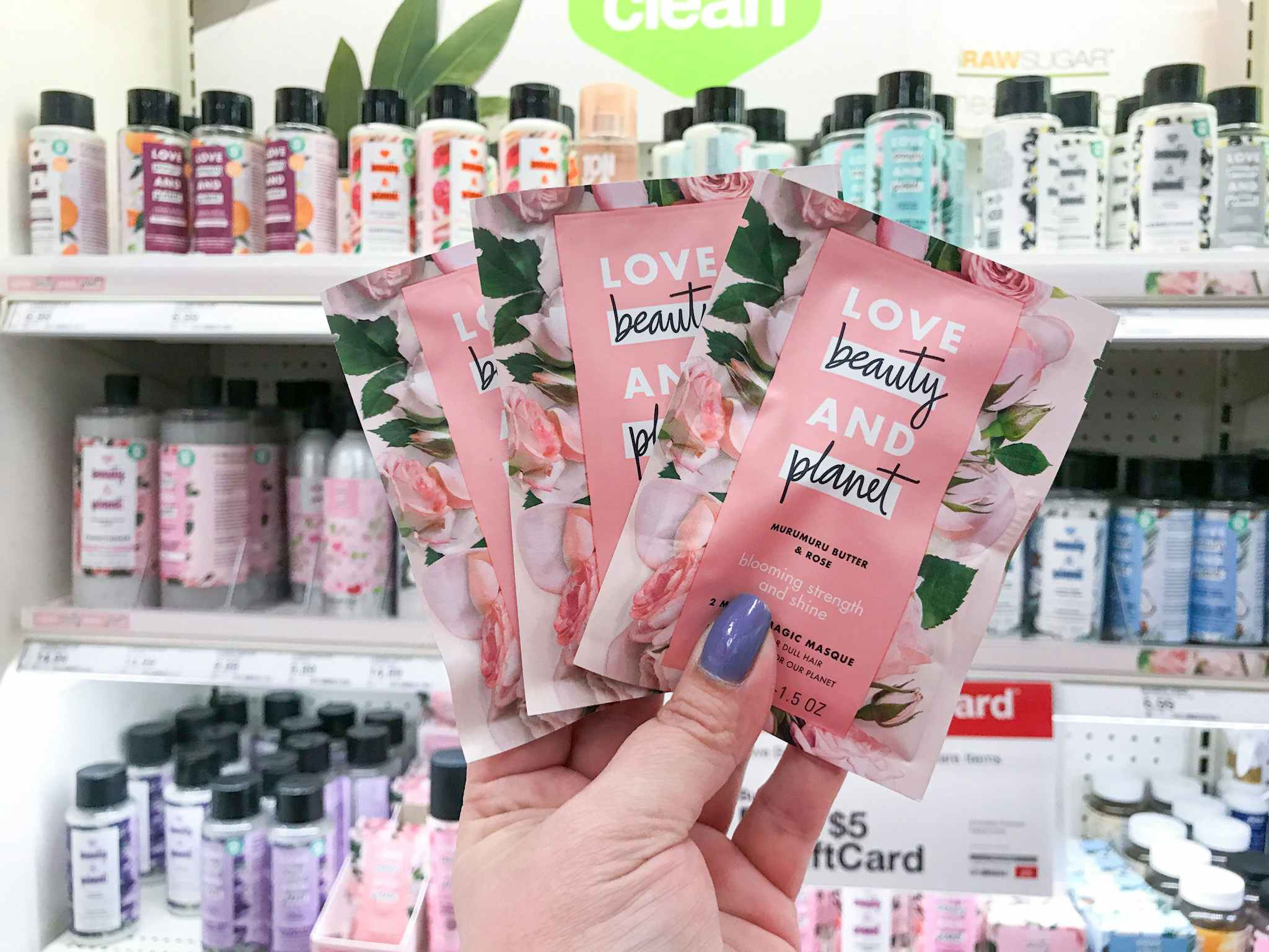 hand holding love beauty and planet hair masks