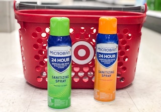 two bottles of Microban on the floor in front of a Target basket