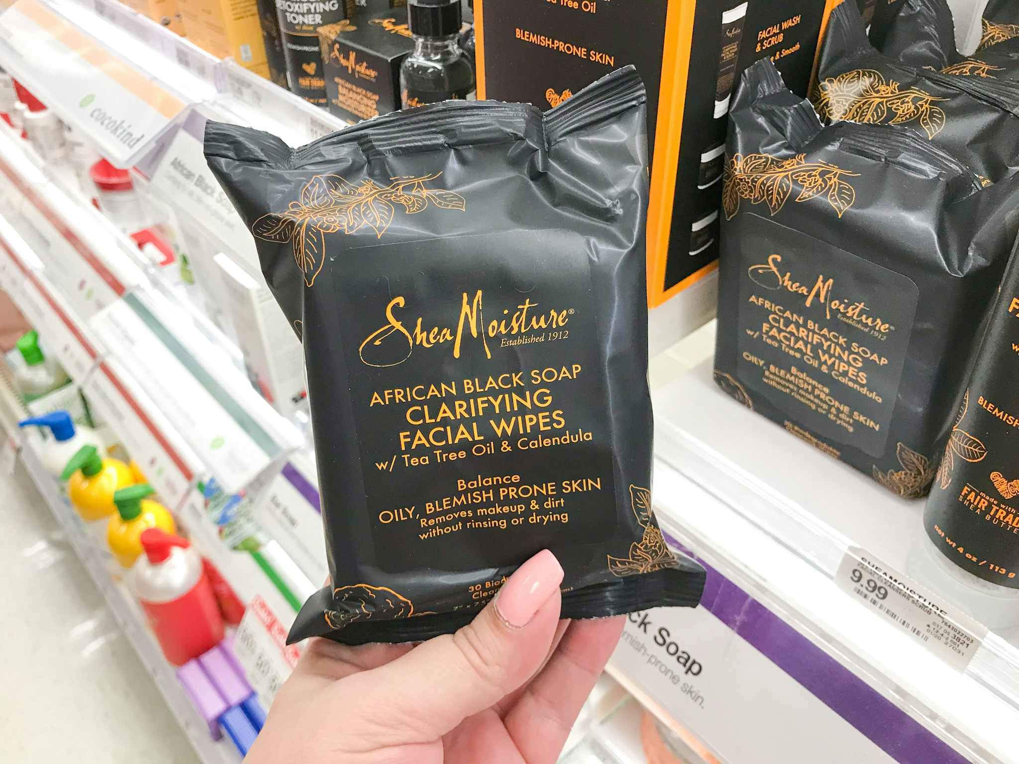 hand holding sheamoisture facial wipes at target