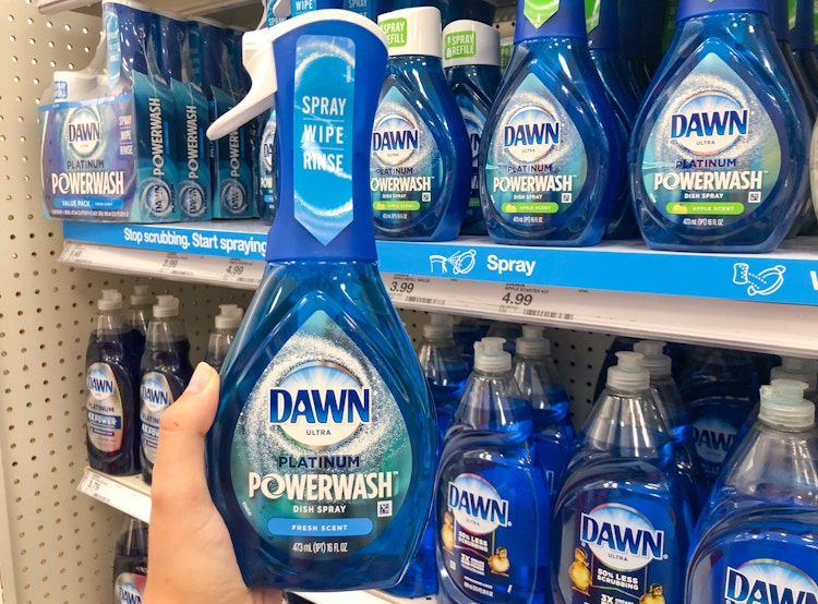hand holding bottle of Dawn in front of store soap display