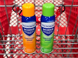 two bottles of Microban disinfectant in a shopping cart