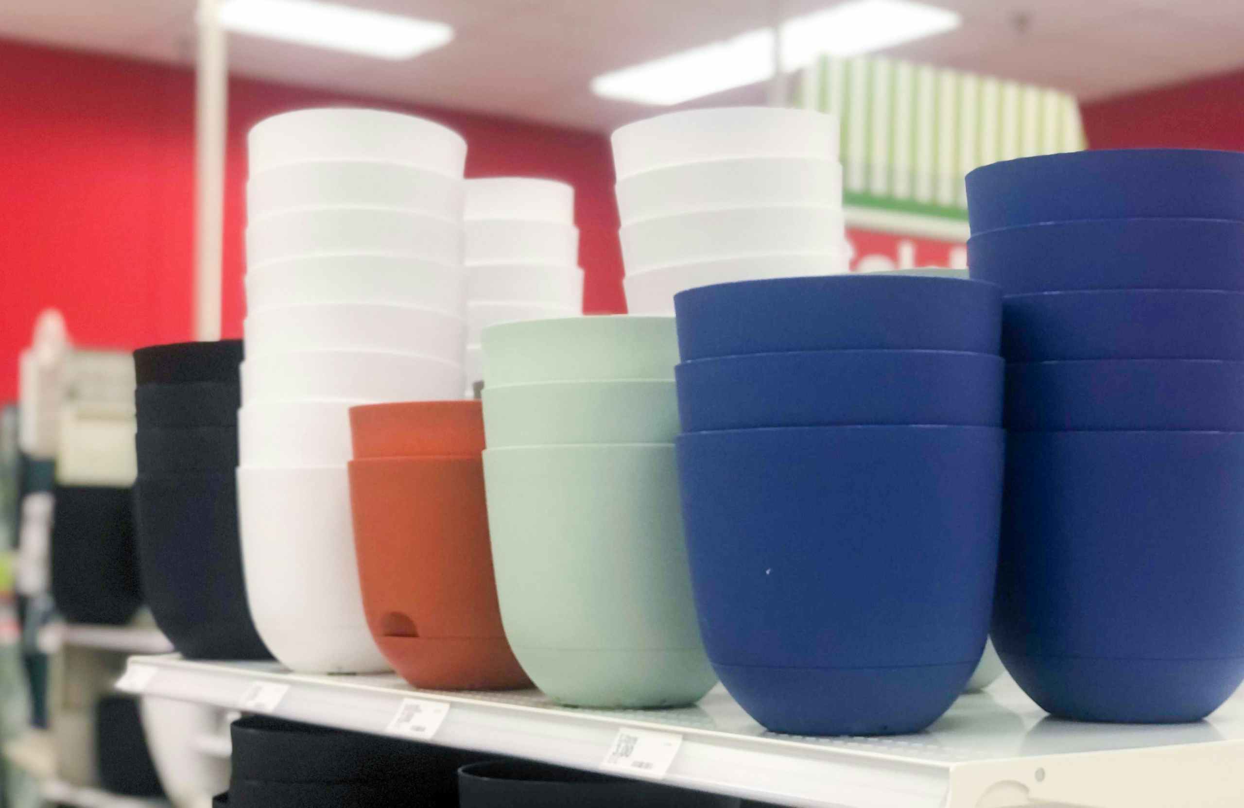 stacked plastic planters on store shelf