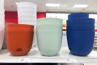 stacked plastic planters on store shelf