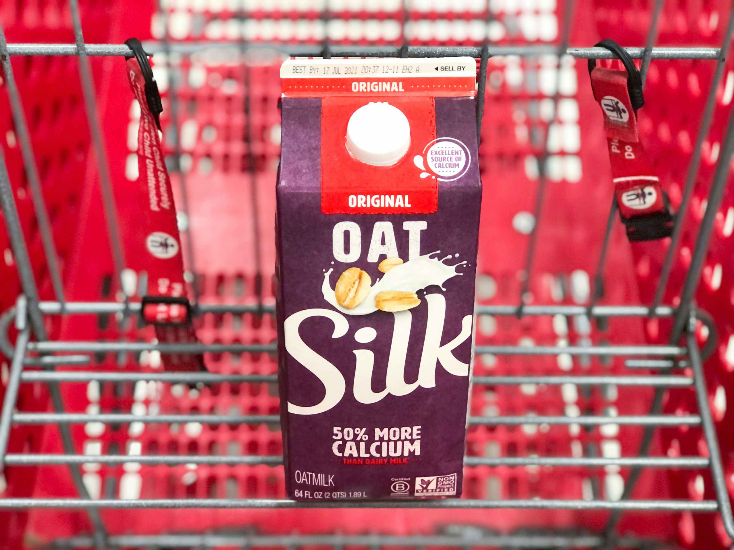 carton of oat milk in shopping cart