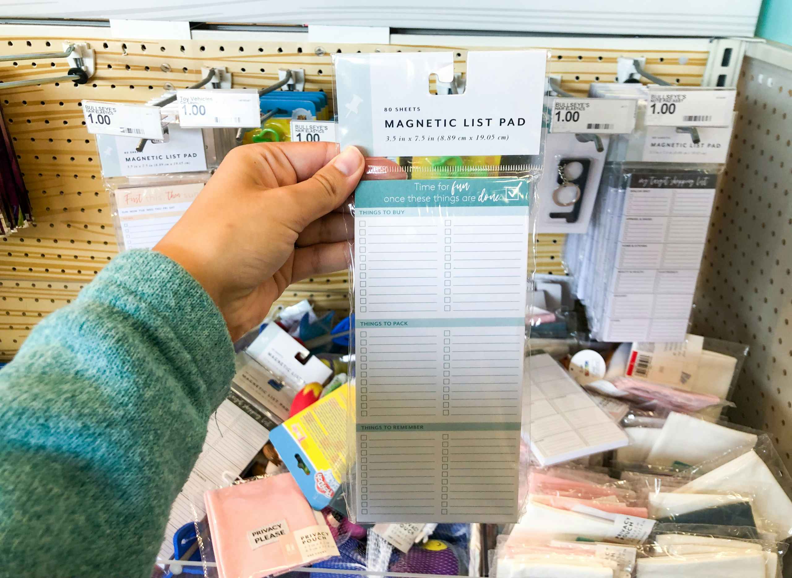 hand holding to do list pad at target