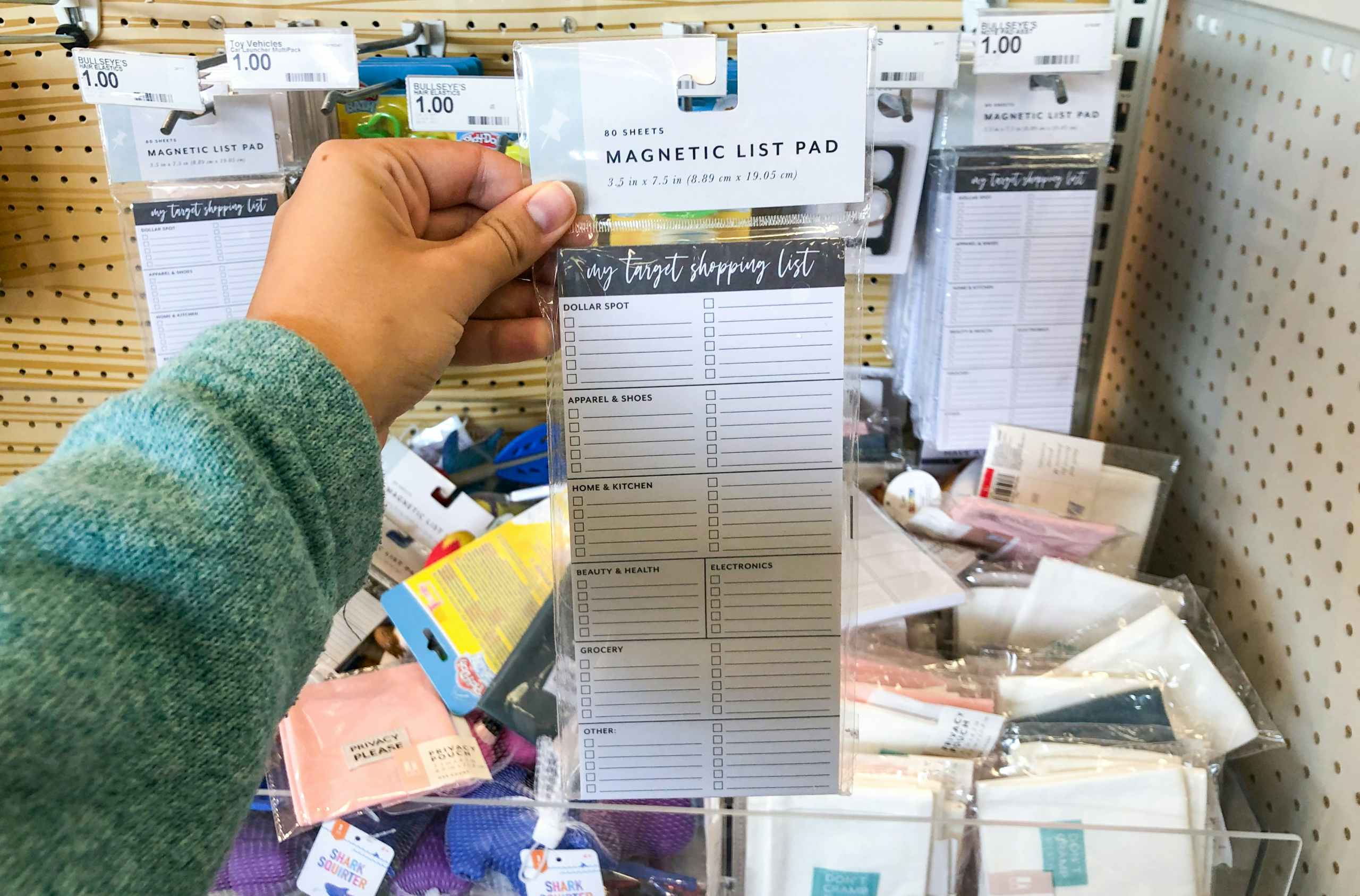 hand holding to do list pad at target
