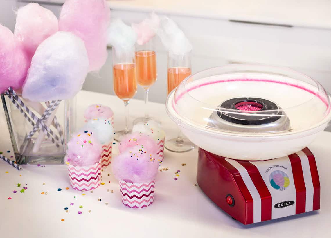stock photo of bella cotton candy maker staged with drinks and party stuff