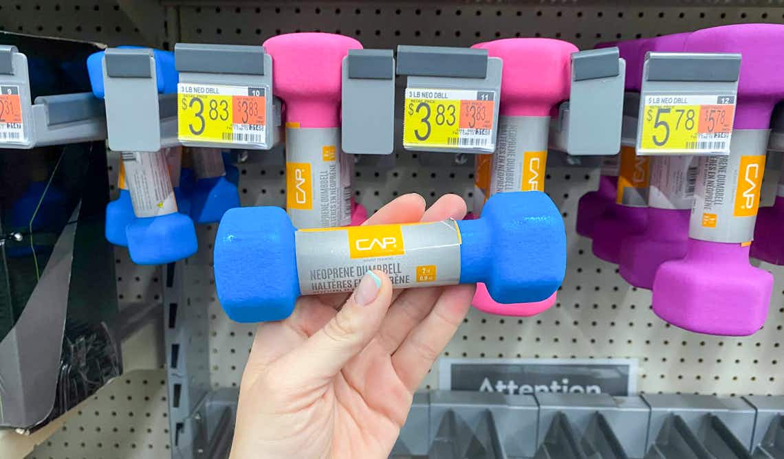 two pound cap neoprene dumbbell held up in front of other dumbbells at walmart