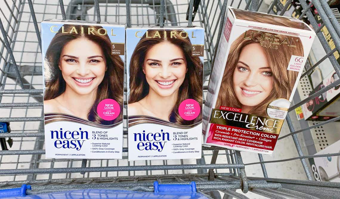 two boxes of clairol nice 'n easy hair color with one box of l'oreal paris excellence hair color in a walmart cart
