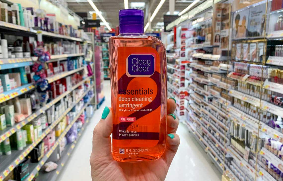 bottle of clean and clear held in center of walmart skin care aisle