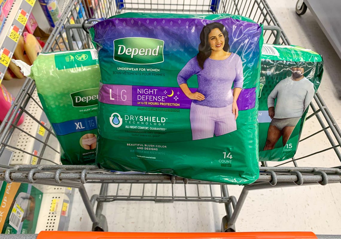 three packs of depend adult underwear products in a walmart cart