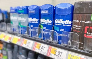 gillette invisible solid deodorant sticks on a walmart shelf with rollback price tags