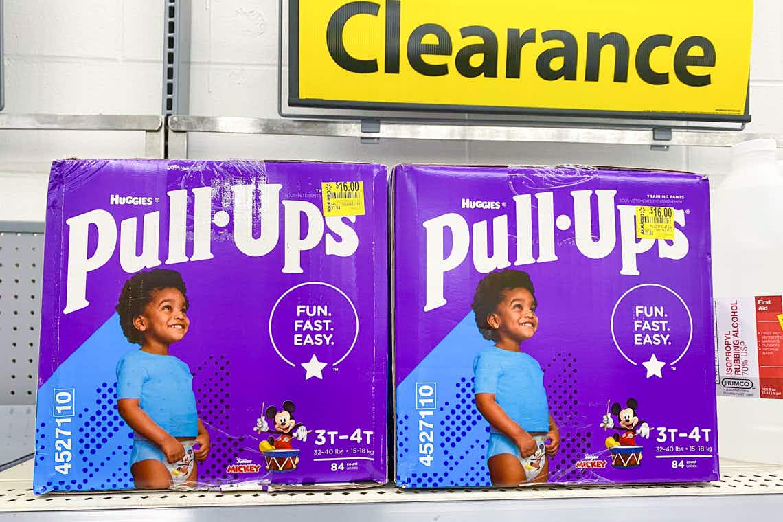 huggies pull-ups training pants on walmart shelf with clearance price tags and signs in the background