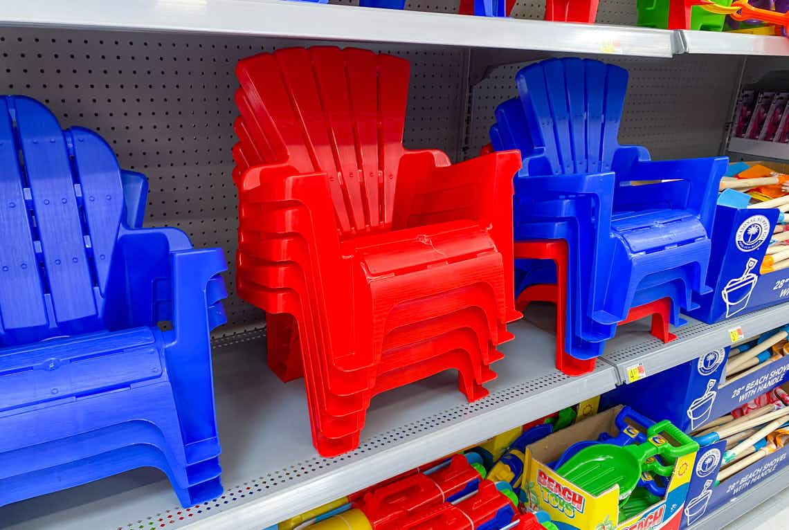 shelf holding blue and red kids adirondak chairs at walmart