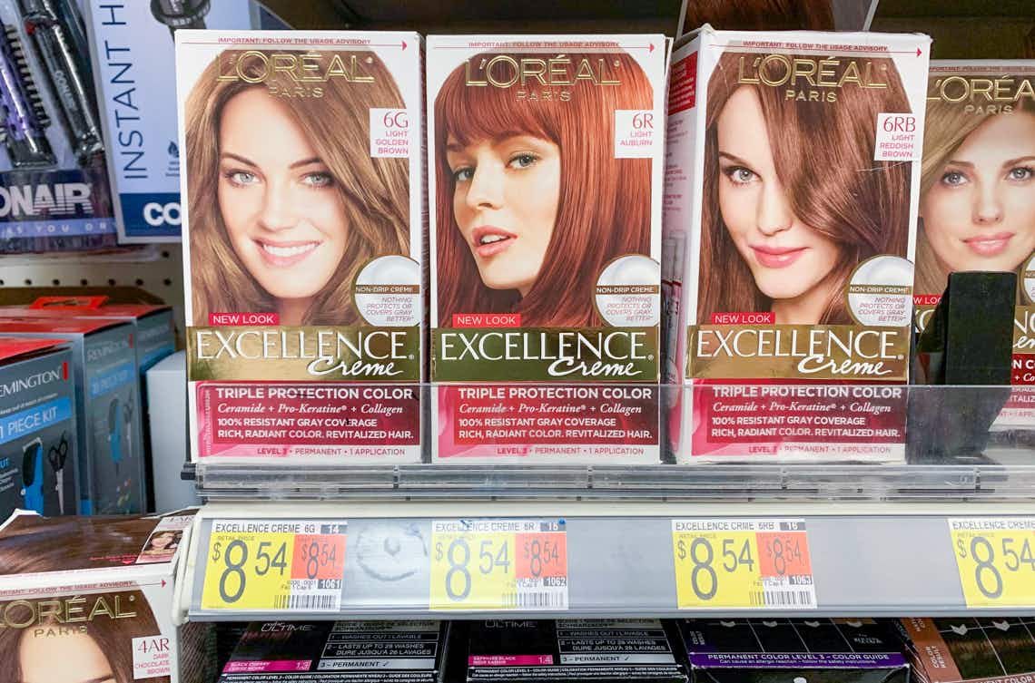 boxes of l'oreal paris excellence hair color on a walmart shelf with price tags