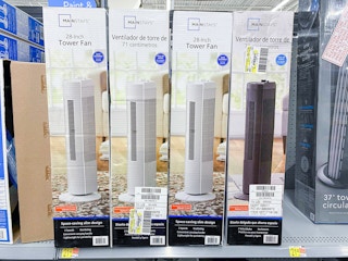 mainstays tower fans on a walmart shelf