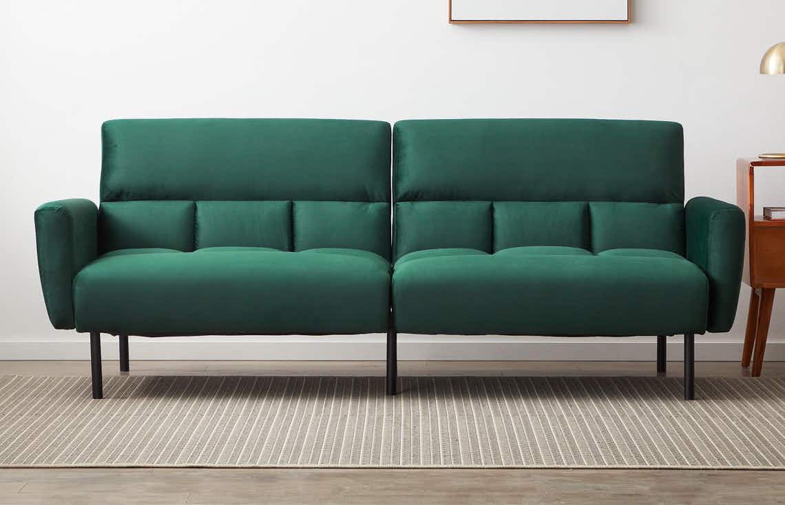 stock photo of green velvet mayview sofa bed in a living room setting