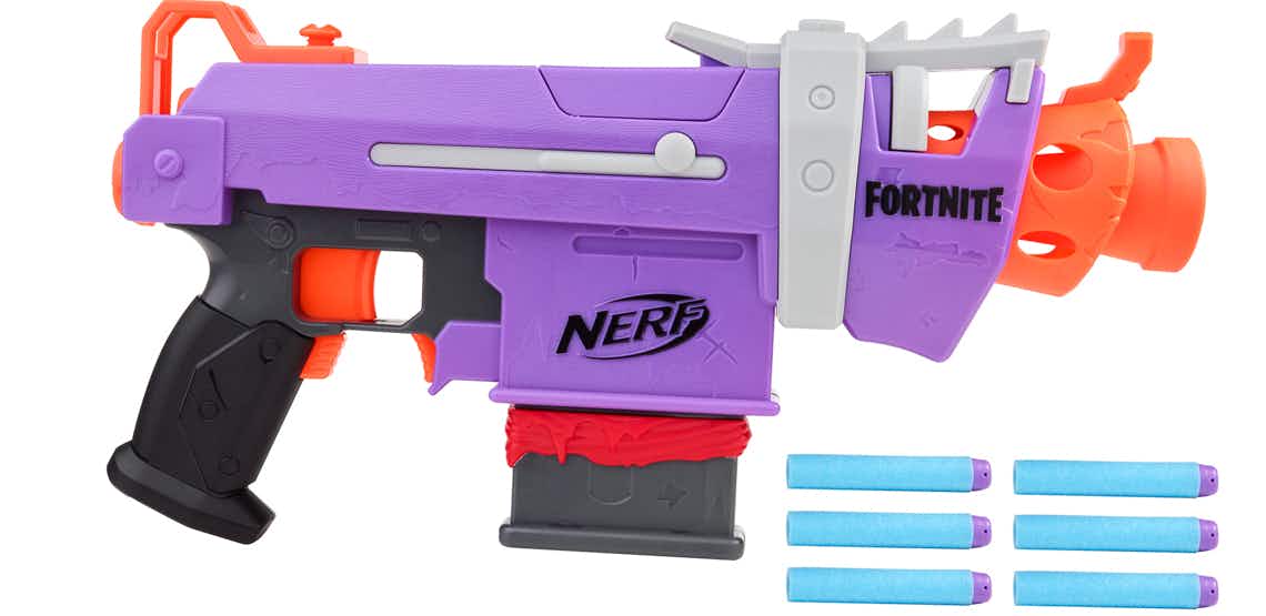 stock photo of purple and orange nerf fortnite smg-e blaster with six blue foam darts on white background