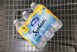 six pack of nestle splash lemon flavored water in a walmart cart